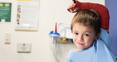 boy receiving pediatric care for broken arm