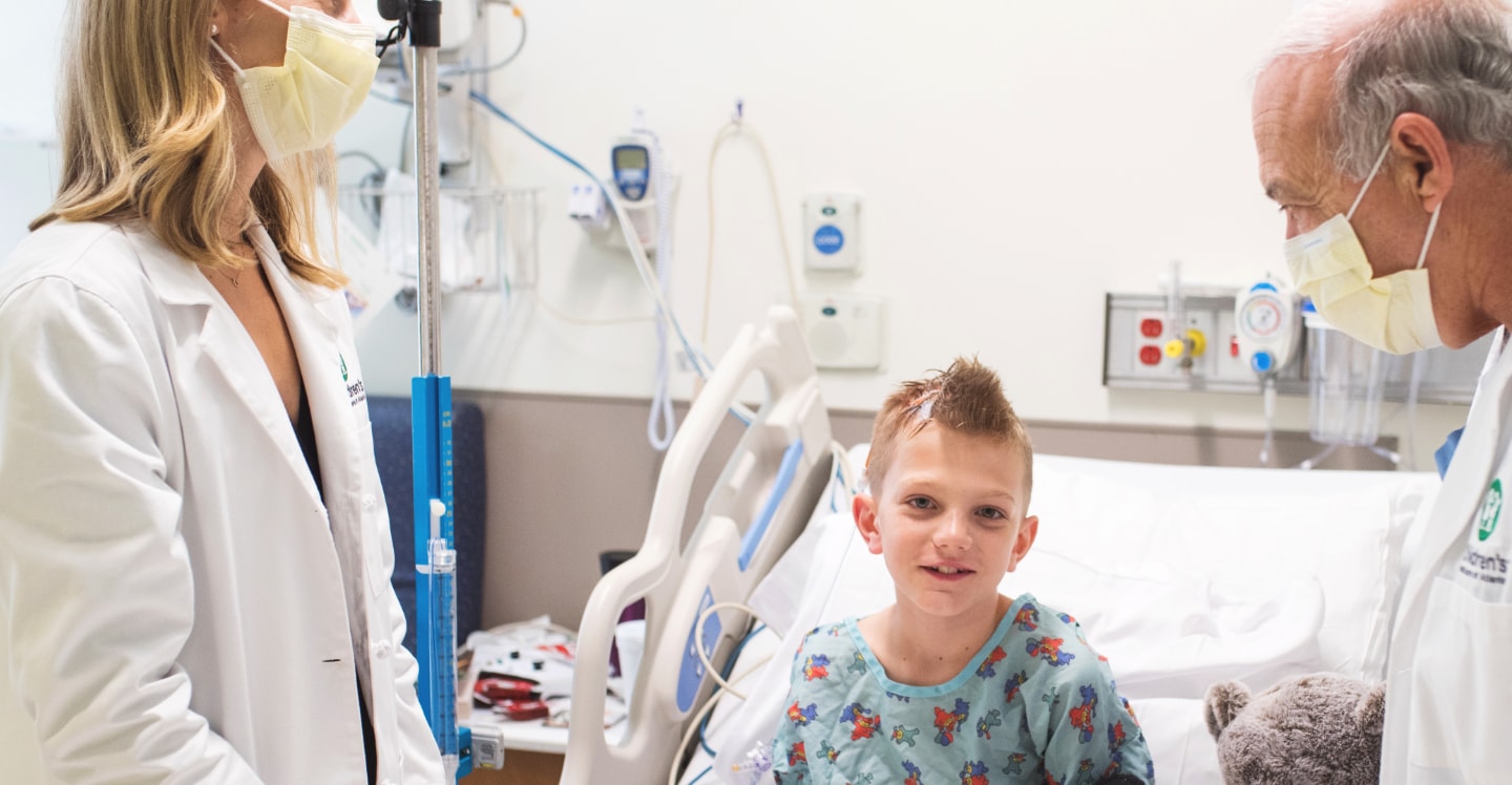 Child post neuro operation with doctor