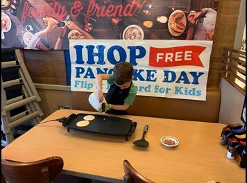child making pancakes