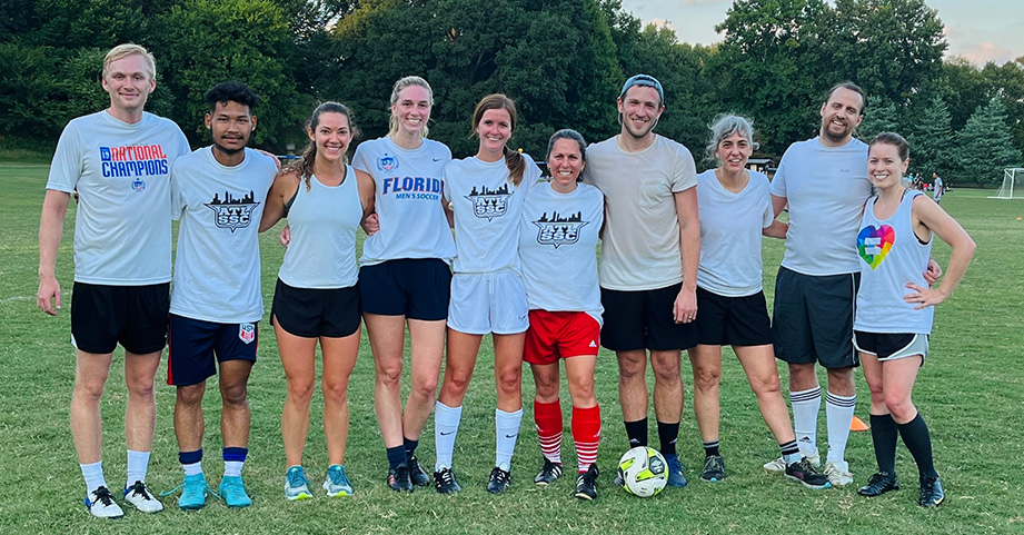 Employees smiling at soccer tournament