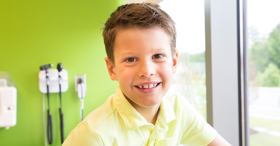 Young boy smiling in clinic room