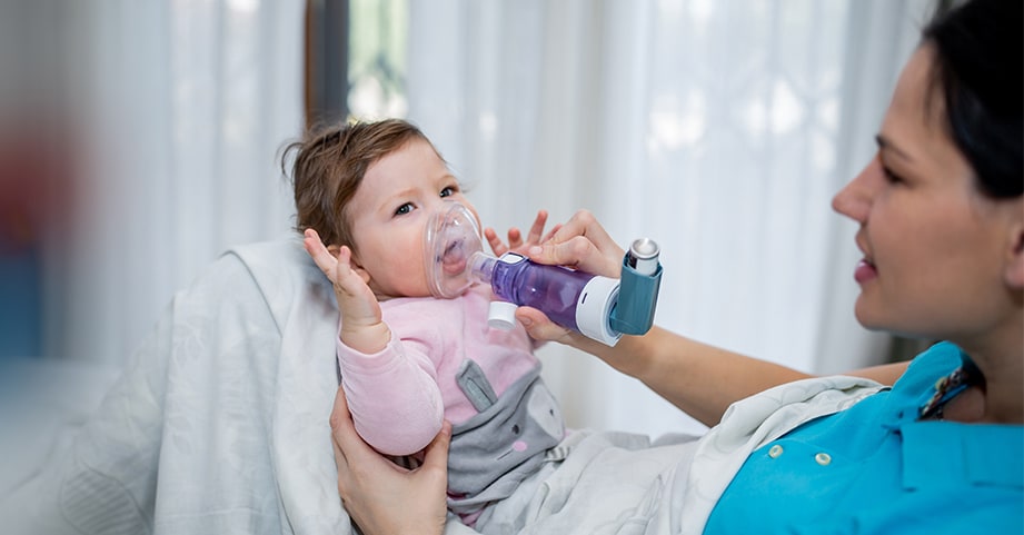 Baby receiving asthma treatment