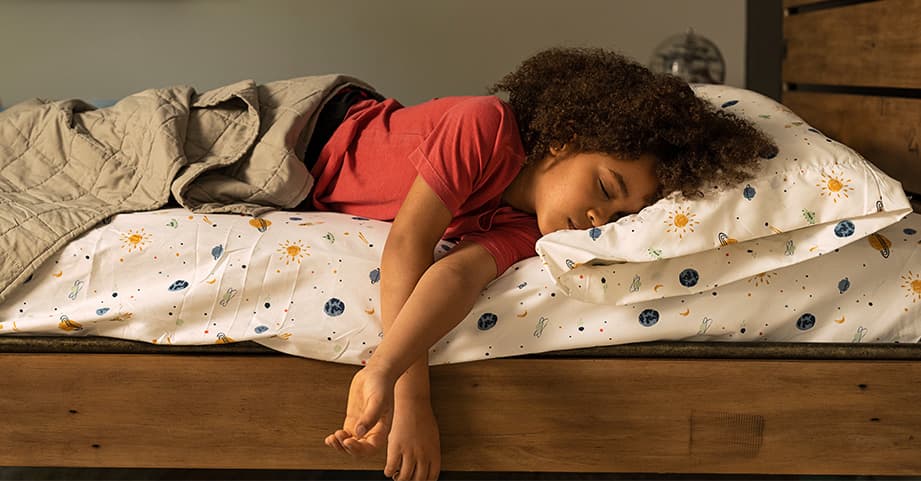 Child sleeping in bed