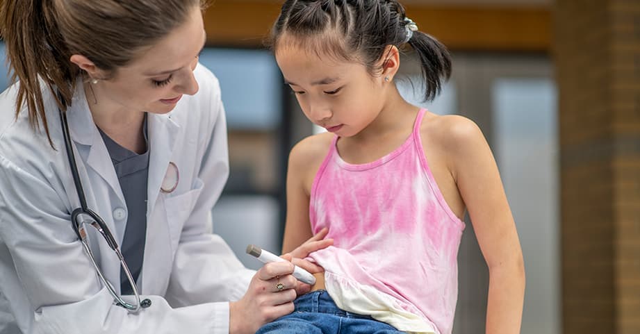 Doctor administering insulin for Children's patient