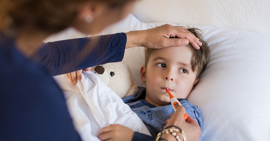 Boy getting his temperature checked