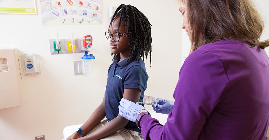 nurse administering flu shot