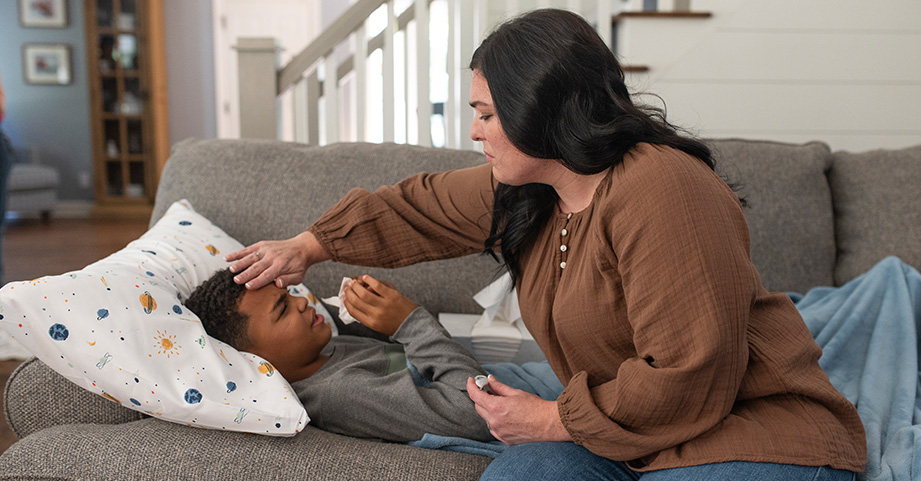 Mother caring for sick child at home