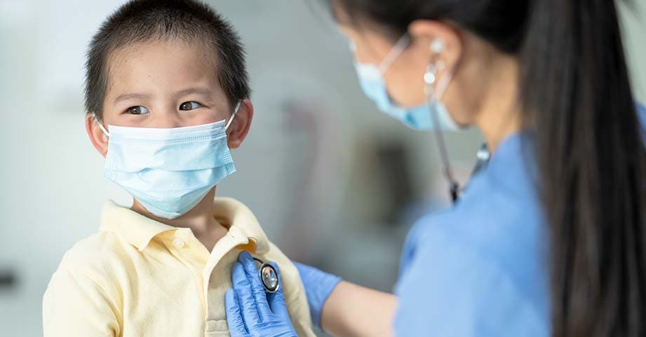 nurse checking a patient's heart beat