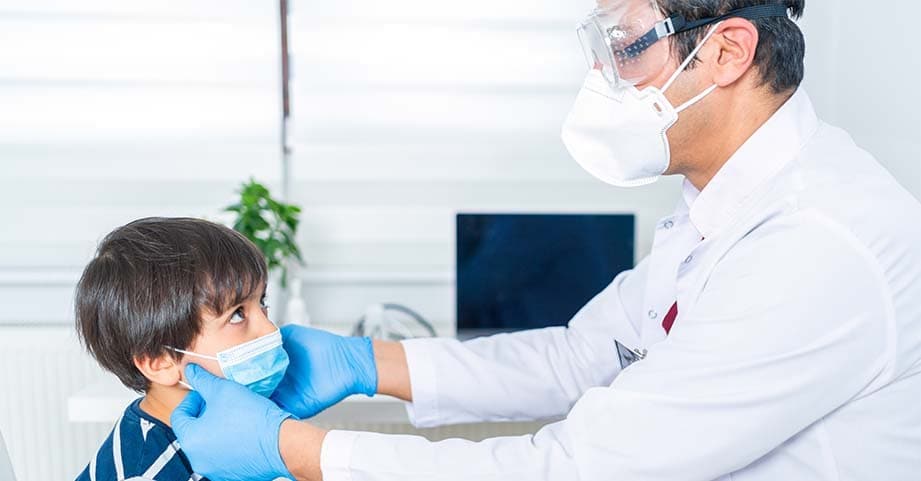 Child being examined by physician