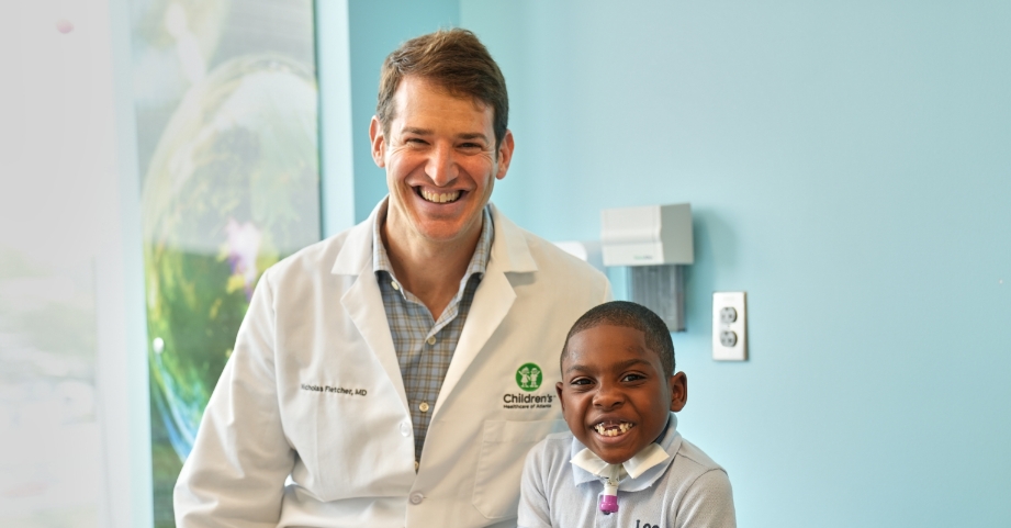 Dr. Fletcher with spine surgery patient
