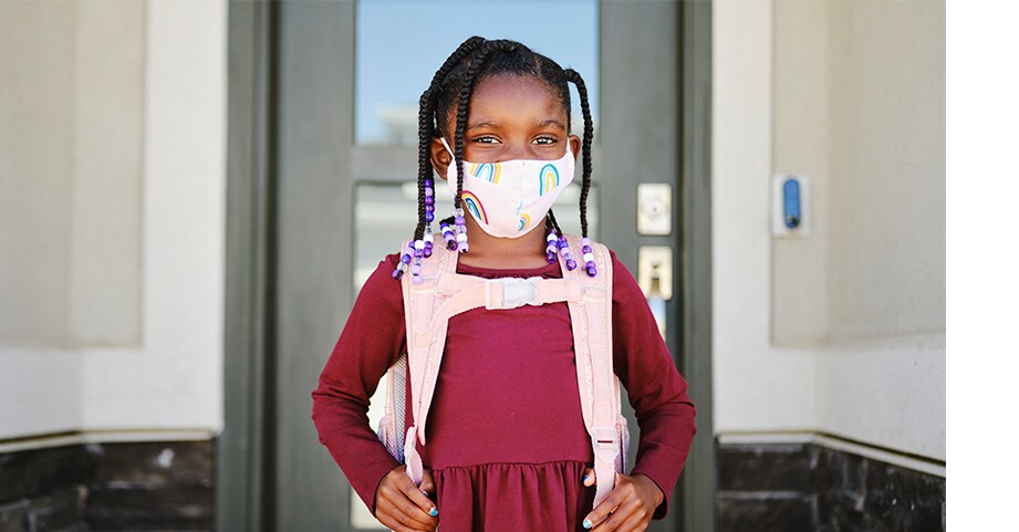 girl wearing backpack with chest strap