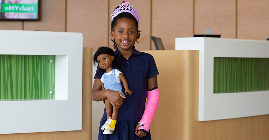 Orthopedic specialist at Children’s Healthcare of Atlanta  diagnosing and treating a teen patient's fracture.