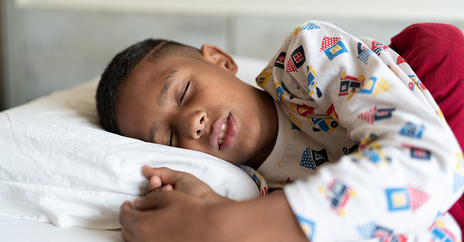 boy in white pajamas sleeping