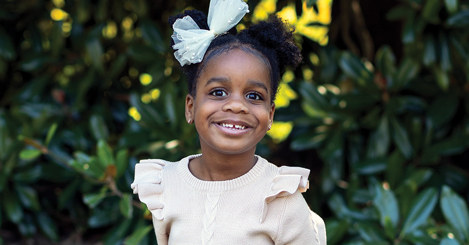 pediatric heart patient girl smiling in garden