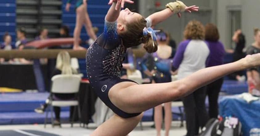 Teen girl in gymnastics meet after pediatric sports physical therapy