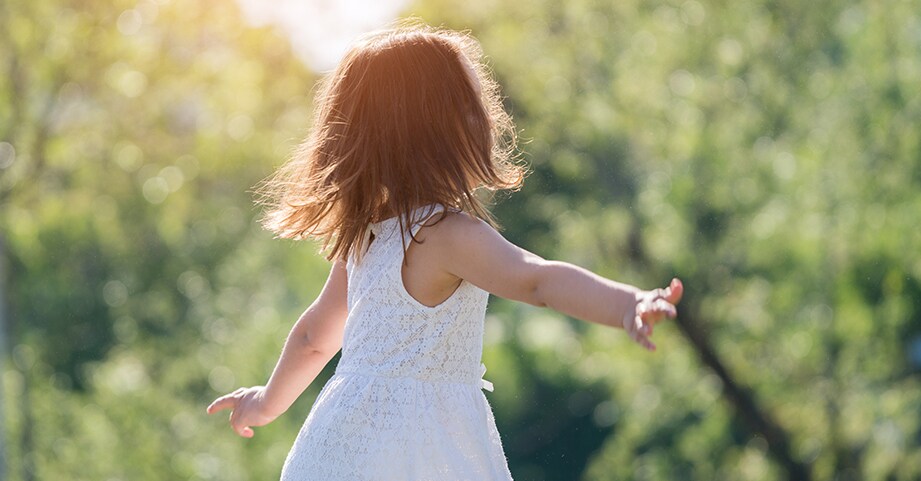 Girl dancing and twirling outside