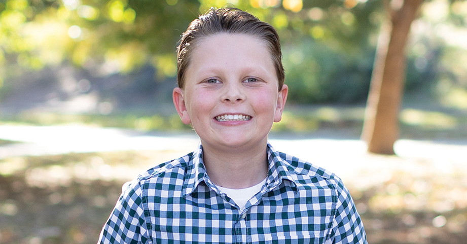 pediatric cancer and sports medicine patient boy smiling in garden
