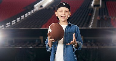 Child holding football