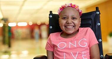 Girl smiling in wheel chair