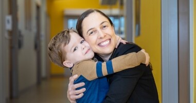Doctor hugging patient