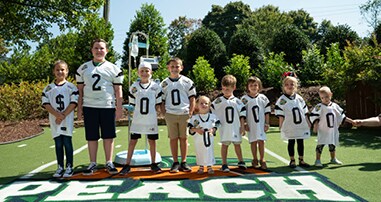 Kids in football jerseys