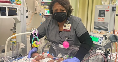 Provider in NICU with baby