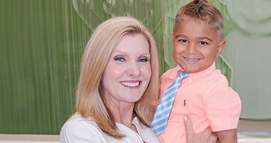Donna Hyland, CEO, with young male patient