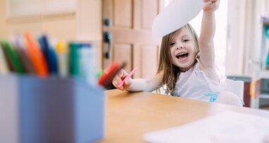 Child playing with markers