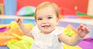 Baby girl smiling in preschool class