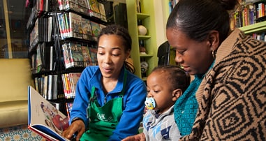 volunteer reading at pediatric hospital