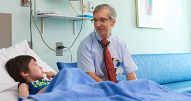 doctor visiting patient at bedside
