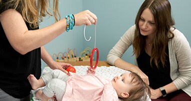baby girl participating in a marcus autism center research study