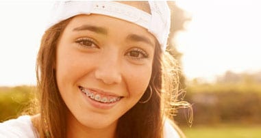 teen girl smiling at the camera