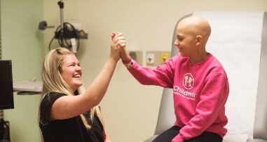 Pediatric cancer nurse celebrates child
