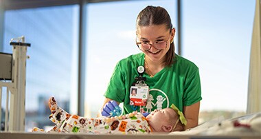 Nurse taking care of infant in cacu