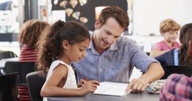 teacher and child in classroom