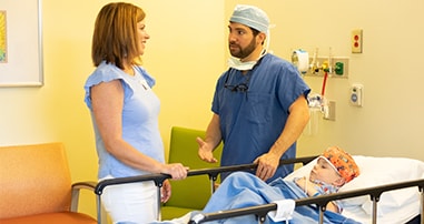Pediatric doctor prepping patient before surgery