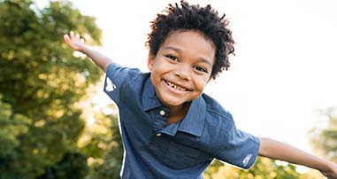 Young boy playing outside