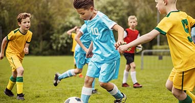Child playing soccer