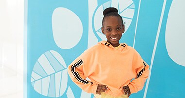 Smiling girl in hospital lobby