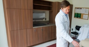 Doctor observing a patient's knee