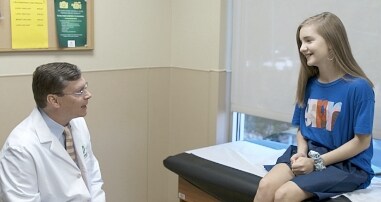 Physician with patient after surgery