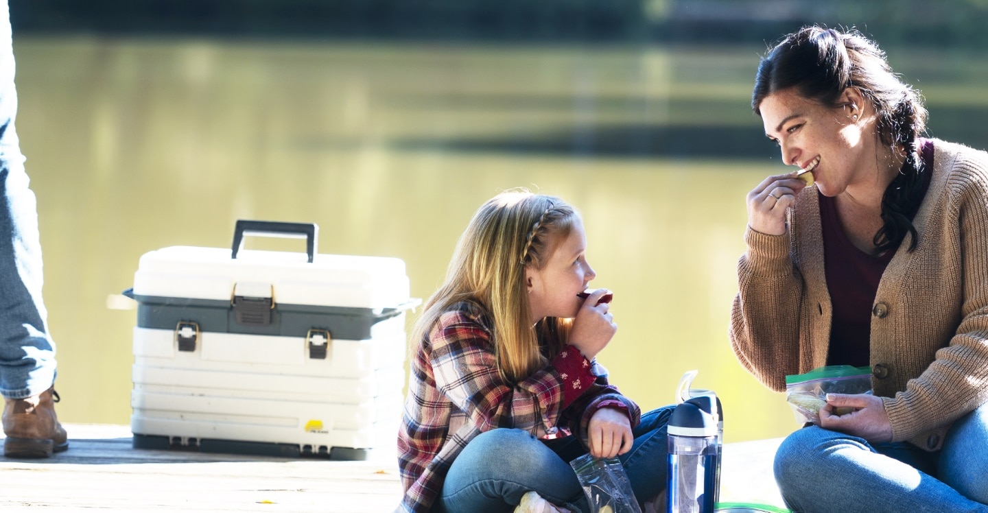 Mom and daughter share snacks