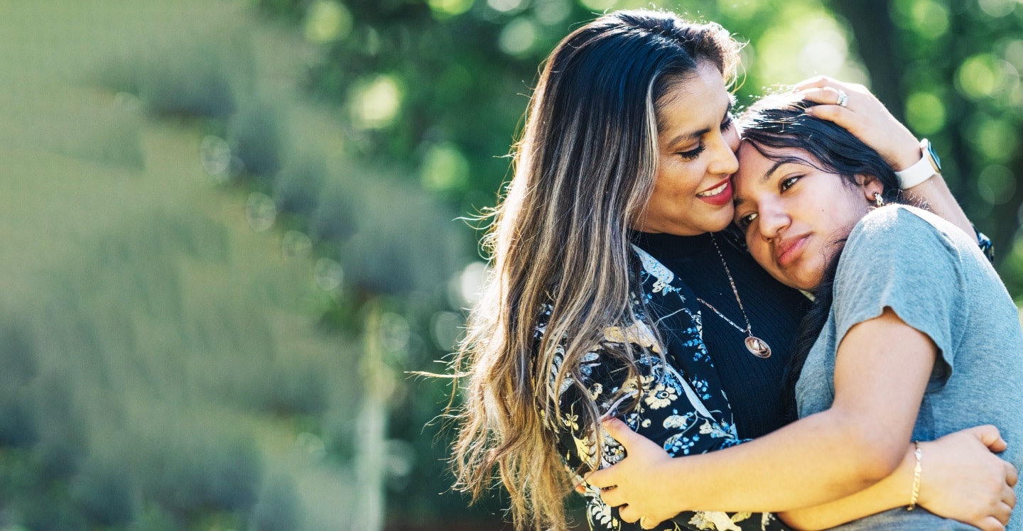 Mom and daughter hugging