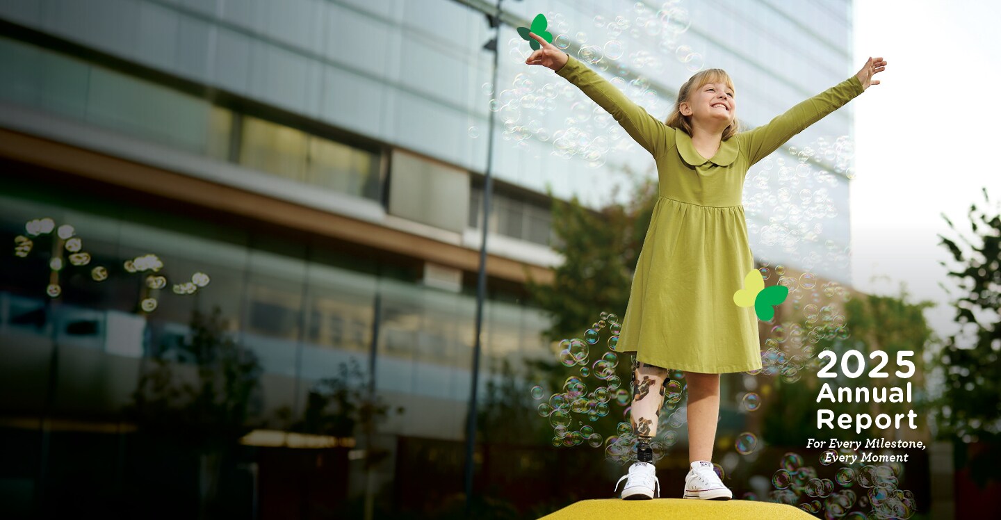 child in front of hospital