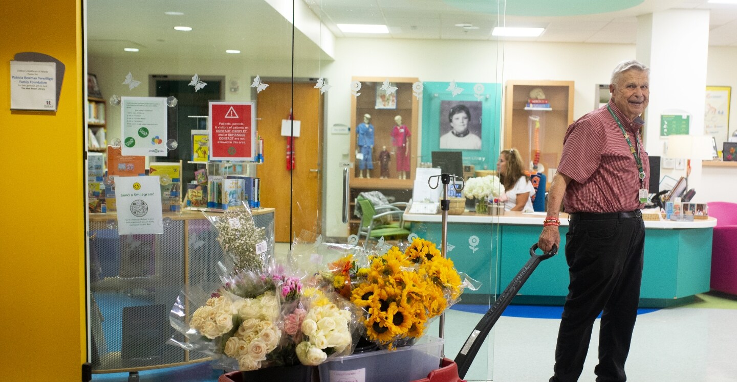 Children's employee pulling flowers in a wagon