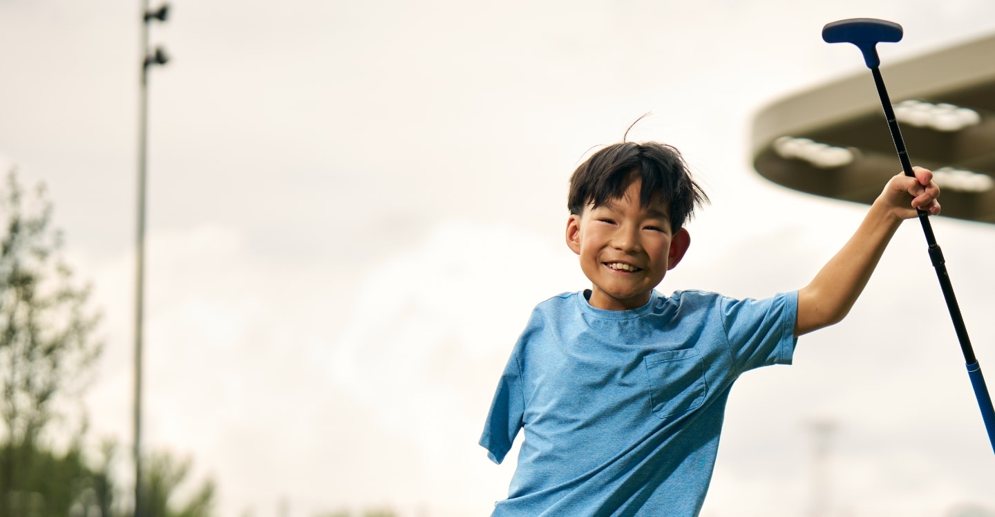 pediatric patient playing golf