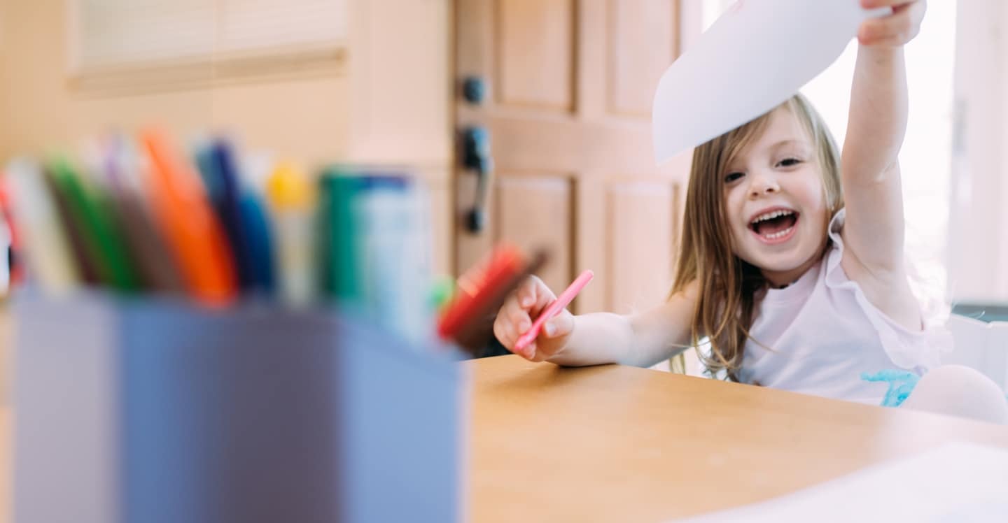 Child playing with markers