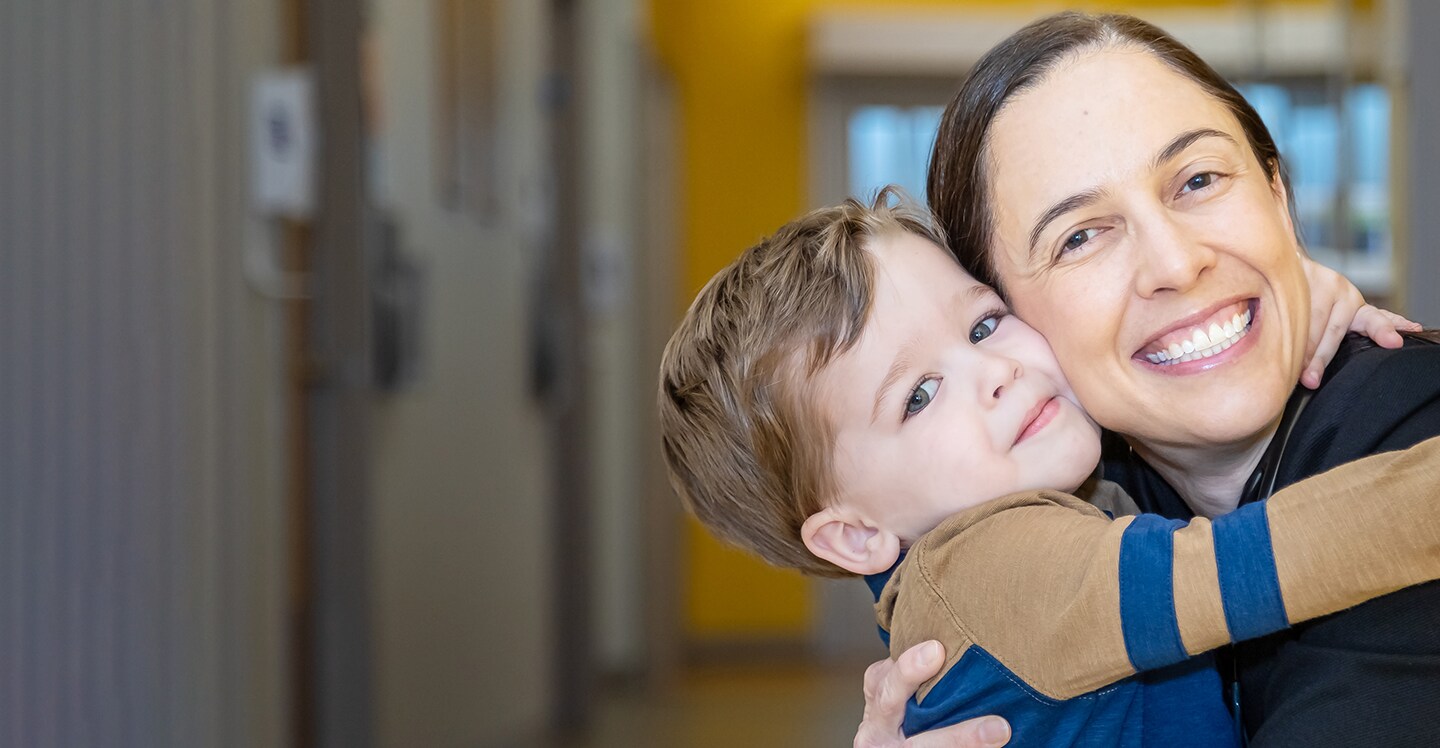 Doctor hugging patient