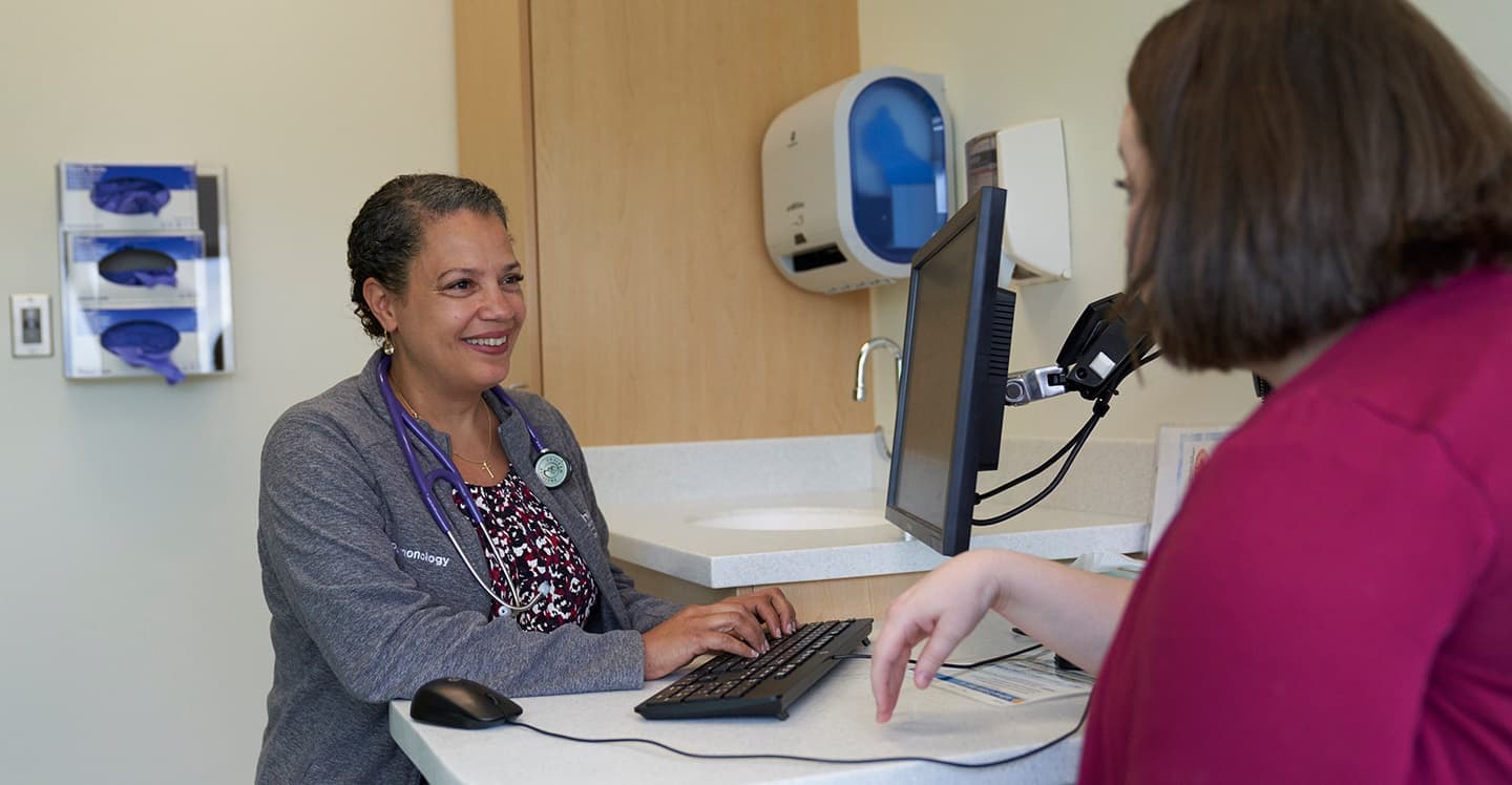 Pulmonology doctor at her computer